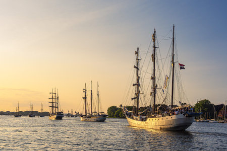 Sailing ships on the river Warnow during the Hanse Sail in Rostock, Germany.