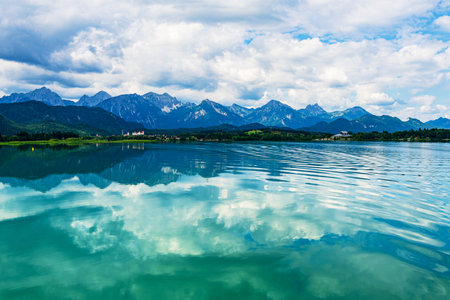 View over the Forggensee lake to the Allgau Alps near Fuessen, Germany.の写真素材
