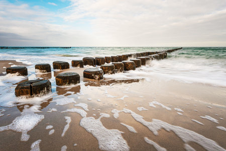 Groynes on shore of the Baltic Sea on a stormy day.の写真素材