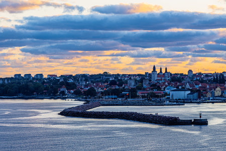 View across the harbor entrance with pier to the old town of Visby, Sweden.の写真素材