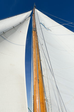 Parts of an old wooden Sailboat on a Lake