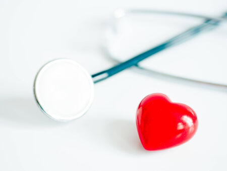 Heart with stethoscope isolated on white backgroundの写真素材