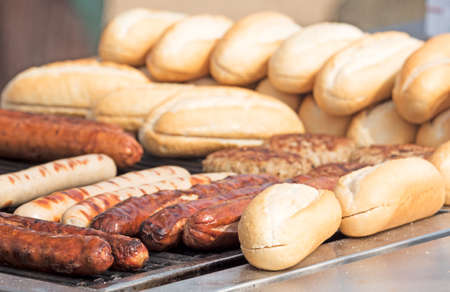 Thuringian sausages with white bread on the grillの写真素材