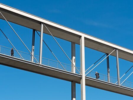 modern footbridge in front of blue skyの写真素材