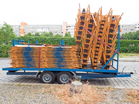 Trailer with benches and tabletops parked on the street