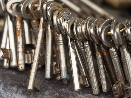many rusty old keys on metal keyring