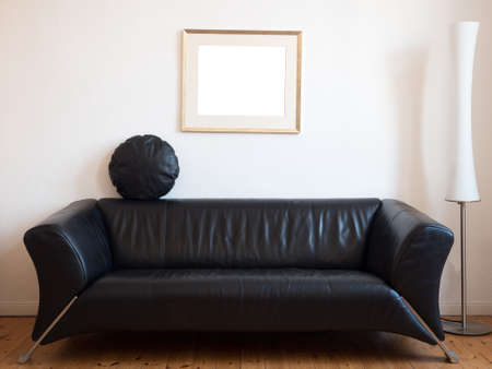Black sofa with lamp in the living roomの写真素材
