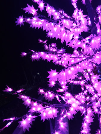 Pink Christmas tree decoration at night