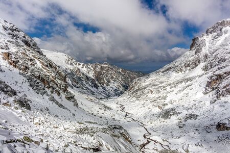 River crossing the valley at the winter at the Rila mountain in Bulgaria, Maliovica.の写真素材