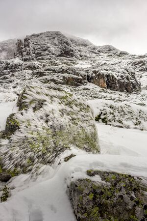Icy rocks after a winter wind at the Rila mountain in Bulgaria, Maliovica.の写真素材