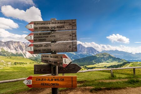 Beautiful wood sign at the amazing Val Gardena valley in Dolomites mountains, Alps, Italy.の写真素材