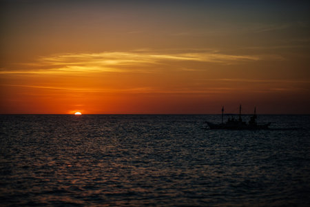 Boat and sunsetの写真素材