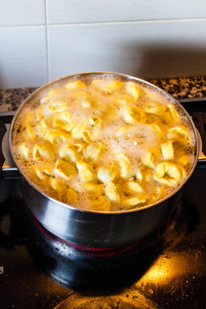 pasta tortellini cooking in pot