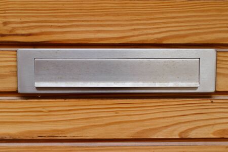 Mailbox of letters in wood doorの写真素材