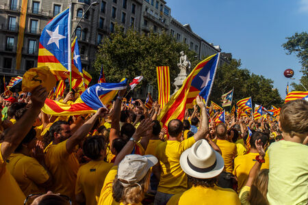 BARCELONA, SPAIN - SEPT. 11: People manifesting ingependence of Scotlandon and Catalonia at the strret of Barcelona during the National Day of Catalonia on Sept. 11, 2014 in Barcelona, Spain.のeditorial素材