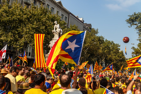 BARCELONA, SPAIN - SEPT. 11: People manifesting ingependence of Scotlandon and Catalonia at the strret of Barcelona during the National Day of Catalonia on Sept. 11, 2014 in Barcelona, Spain.のeditorial素材