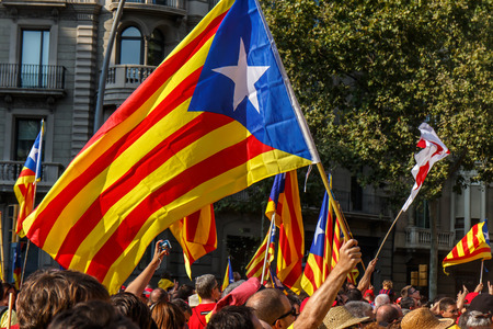 BARCELONA, SPAIN - SEPT. 11: People manifesting ingependence of Scotlandon and Catalonia at the strret of Barcelona during the National Day of Catalonia on Sept. 11, 2014 in Barcelona, Spain.のeditorial素材