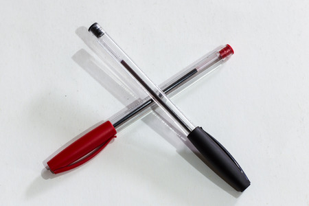 black and red pens isolated on white backgroundの写真素材