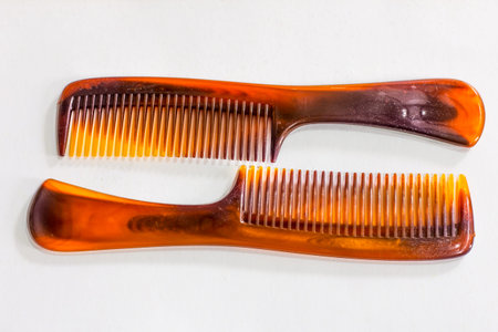 two brown comb isolated on white backgroundの写真素材