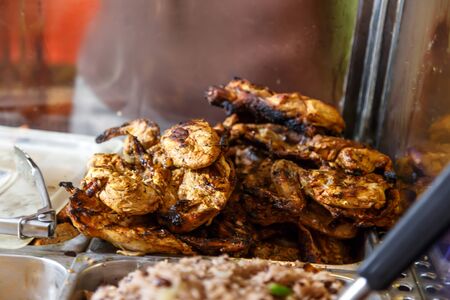 roasted chicken closeup from prepared platesの写真素材