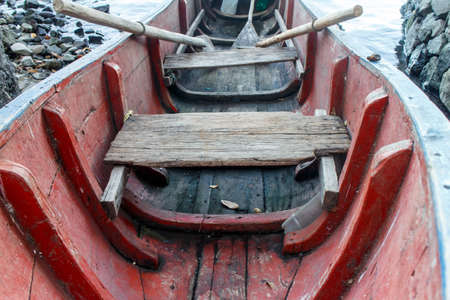 old wood boat in red, closeup detailの写真素材