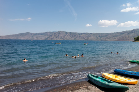 Laguna de Apoyo, Nicaragua- March 28 2015: People swimming in lake and kayaks aroundのeditorial素材