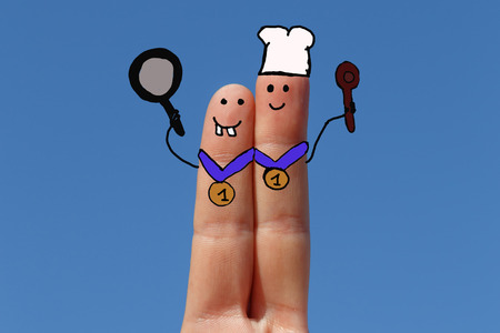 cookers, two fingers painted with sky at backgroundの写真素材