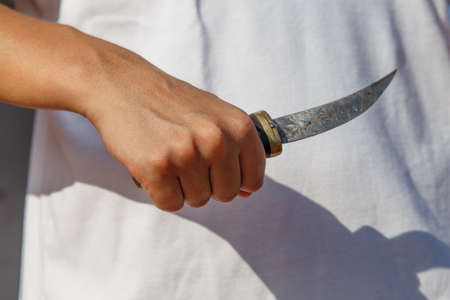 girl with knife at handの写真素材