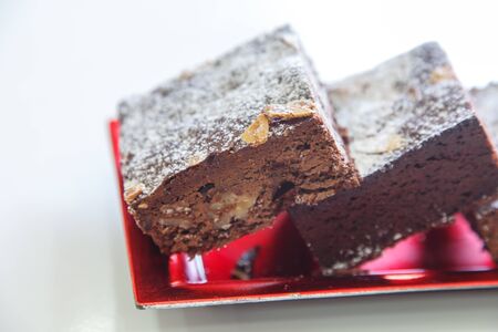 several chocolate cakes lies on a plateの写真素材