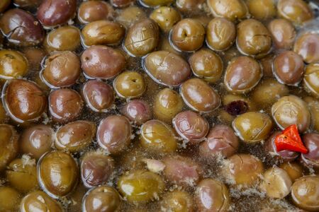 olives in conserve in a pot from marketplaceの写真素材