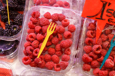Fresh raspberries in the plastic boxの写真素材