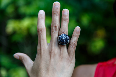 latin girl showing handmade ringsの写真素材