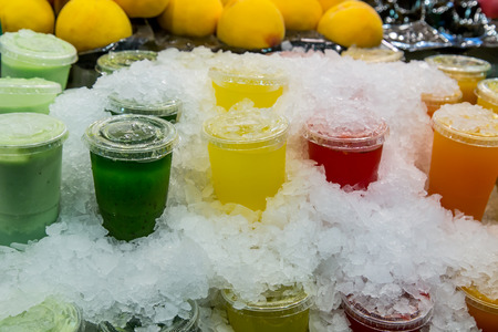 fruit pots and juice at the Boqueria market in Barcelonaの写真素材