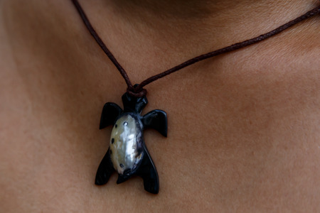 woman wearing a handmade Necklaceの写真素材