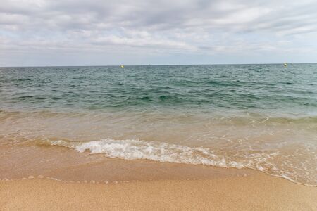 View of the sandy beach of the sea coast of Spainの写真素材