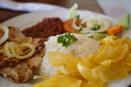 rice with chicken, beans and salad from Nicaraguan cuisineの写真素材