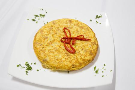 Spanish cuisine. Potatoes omelet served with salad.Tortilla espanola.の写真素材
