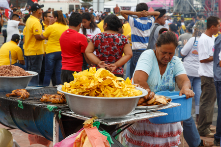 Managua, Nicaragua â July 19, 2016: woman selling food on streetのeditorial素材