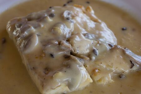 fish with mushrooms sauceの写真素材