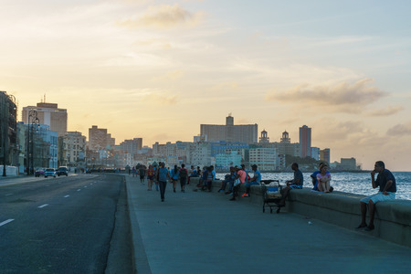 La Havana, Cuba â December 25, 2016: Malecon typical view in sunset with La Havana buildings at backgroundのeditorial素材