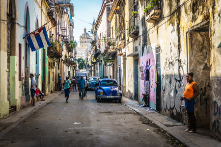 Cuban street view with people and cuban flag, on december 26, 2016, in La Havana, Cubaのeditorial素材