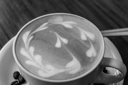 cup of coffee on wooden table B/Nの写真素材