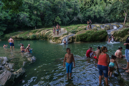 Las Terrazas, Cuba â December 28, 2016: tourist relaxing on natural pool in rio san juan , las terrazas pinar del rioのeditorial素材