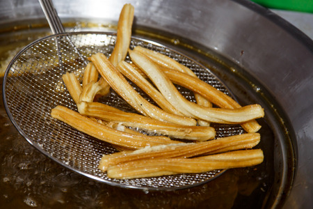 cooking churros, typical spanish food.の写真素材