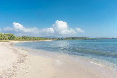 Cuba - Caribbean beach Playa Rancho Luna in Cienfuegos. Sandy coastの写真素材