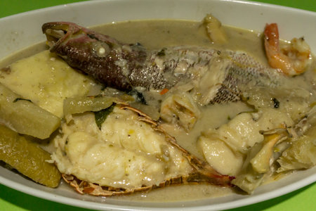nicaragua typical caribbean food, fish soup with coconut named rondownの写真素材