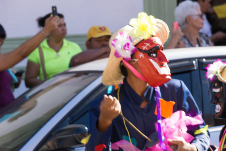 Granada, Nicaragua â€“ February 15, 2017:  People wearing traditional dress and colorful masks...