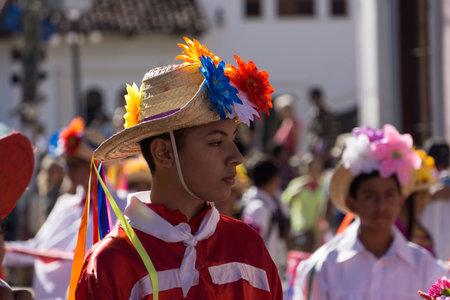 Granada, Nicaragua â€“ February 15, 2017:  People wearing traditional dress and colorful masks...