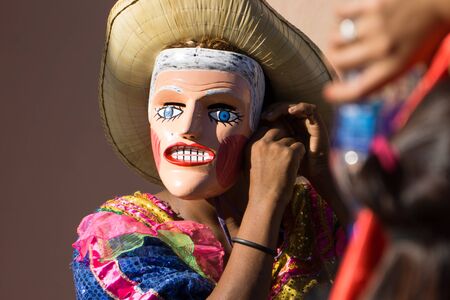 Granada, Nicaragua â February 15, 2017:  People wearing traditional dress and colorful masks during celebration of Carnival. Nicaragua traditional folkのeditorial素材