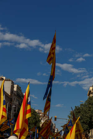 Barcelona, Catalonia, Spain, September 11, 2017: People on street on riot during national day from Catalonia claming for independence of Catalunya in Barcelona with catalan flags. Editorial captionのeditorial素材